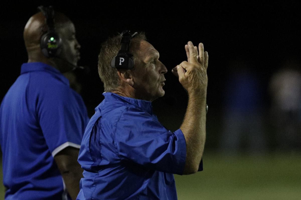 MacArthur's Jeffery Wells and Malachi Thomas push the Generals' defense